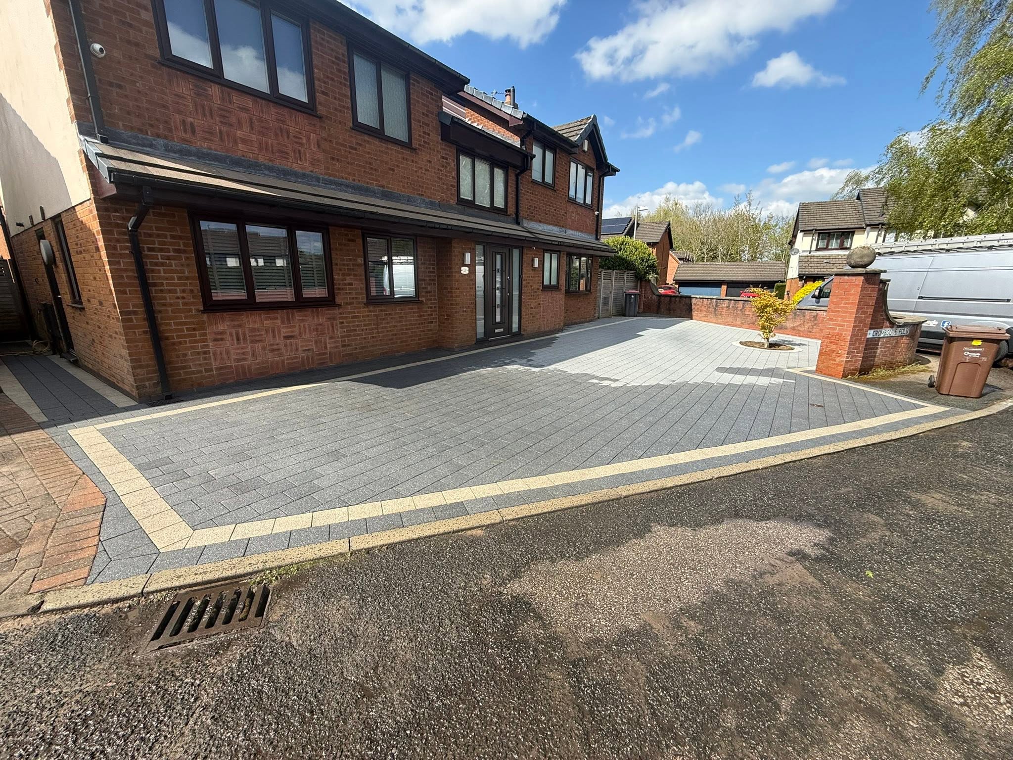 Freshly cleaned block paving driveway with contrasting border