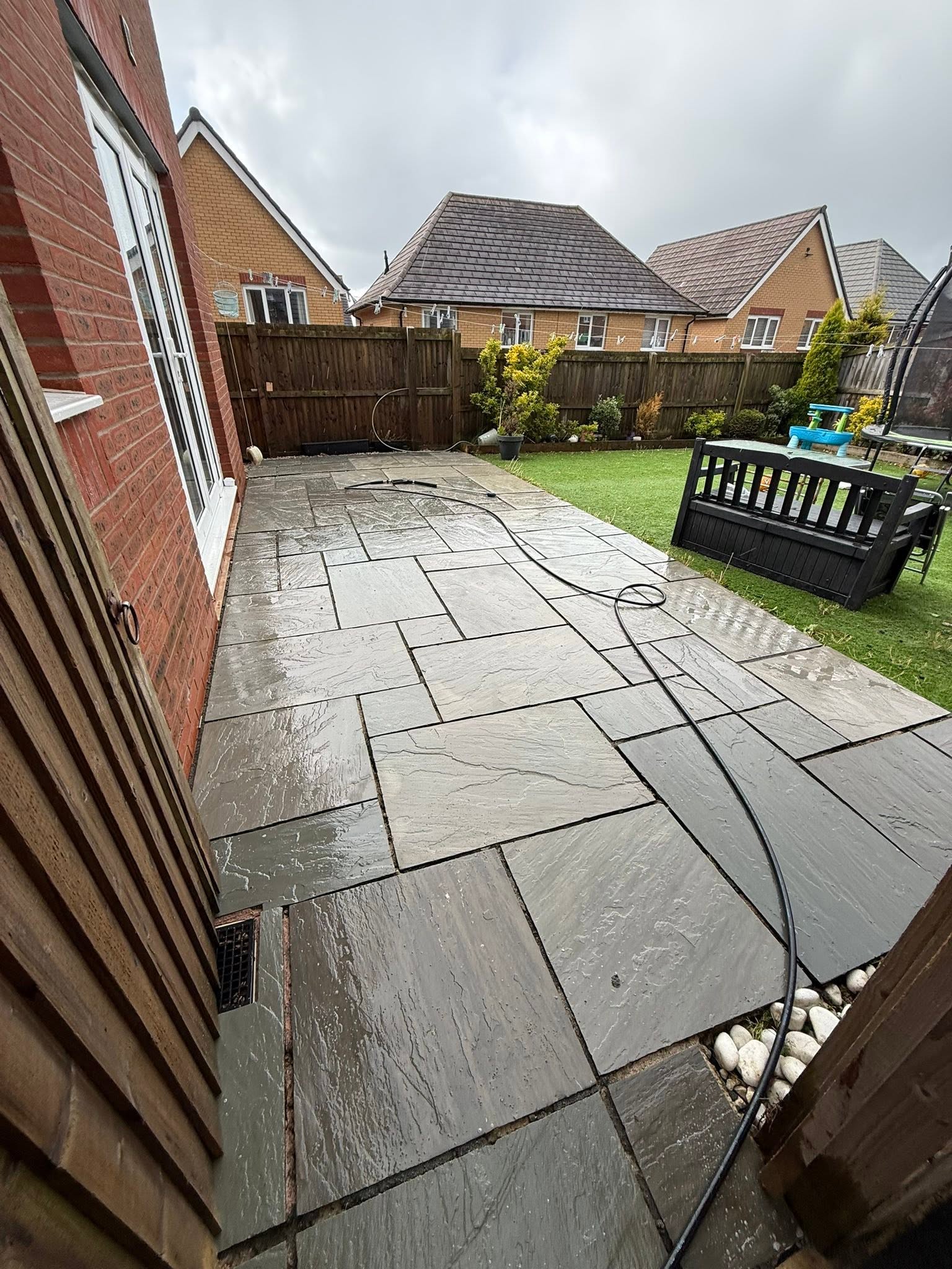 Cleaned riven Indian sandstone patio