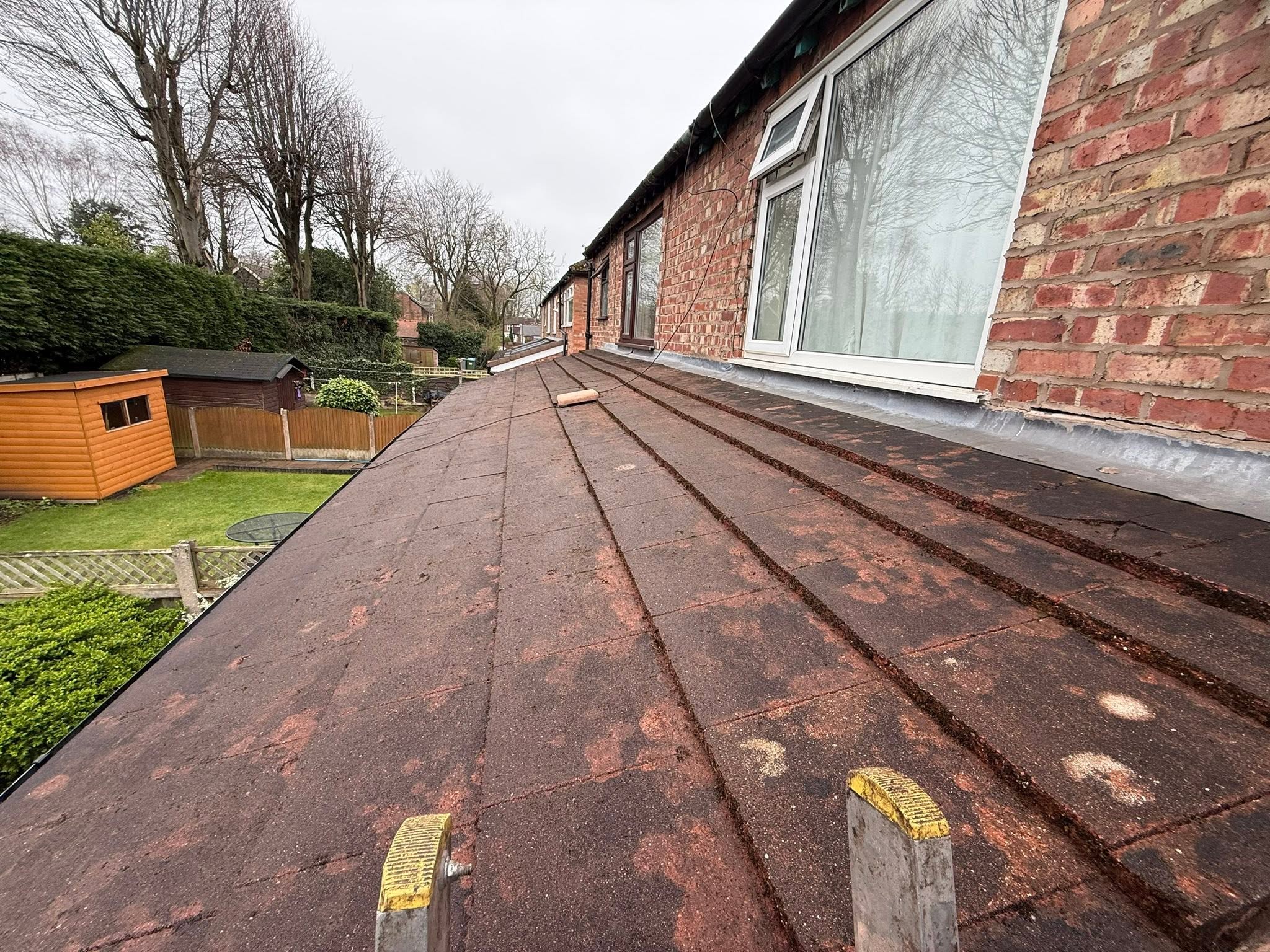 Flat garage roof after moss removal